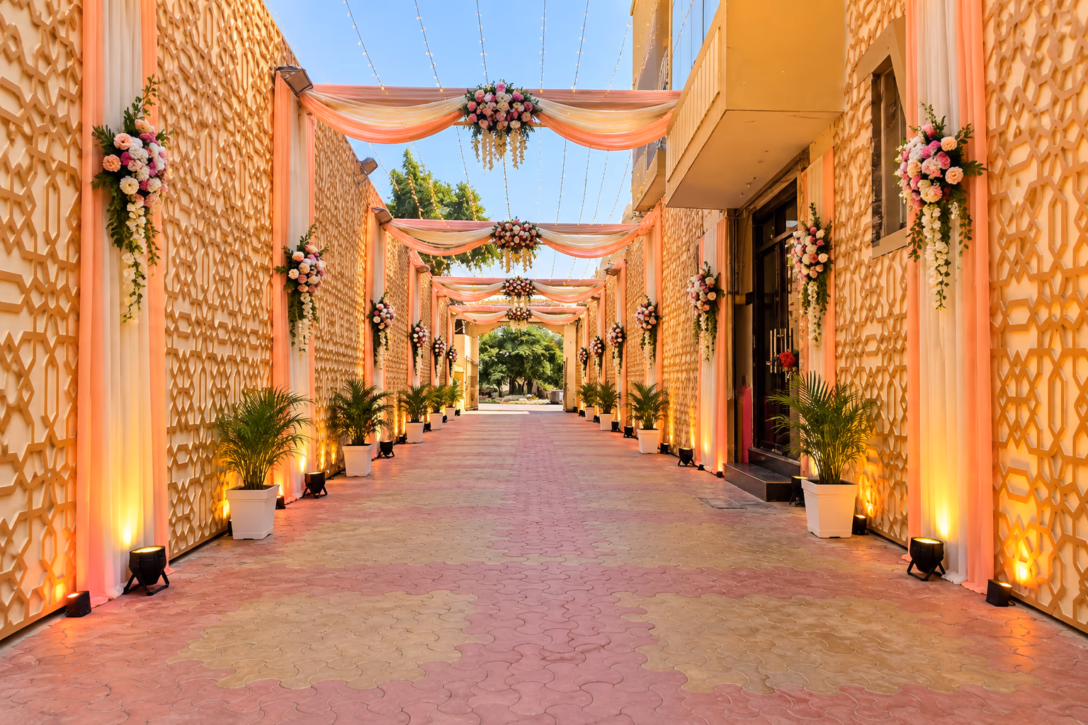 Wedding entrance walkway dressed with flowers and drapes